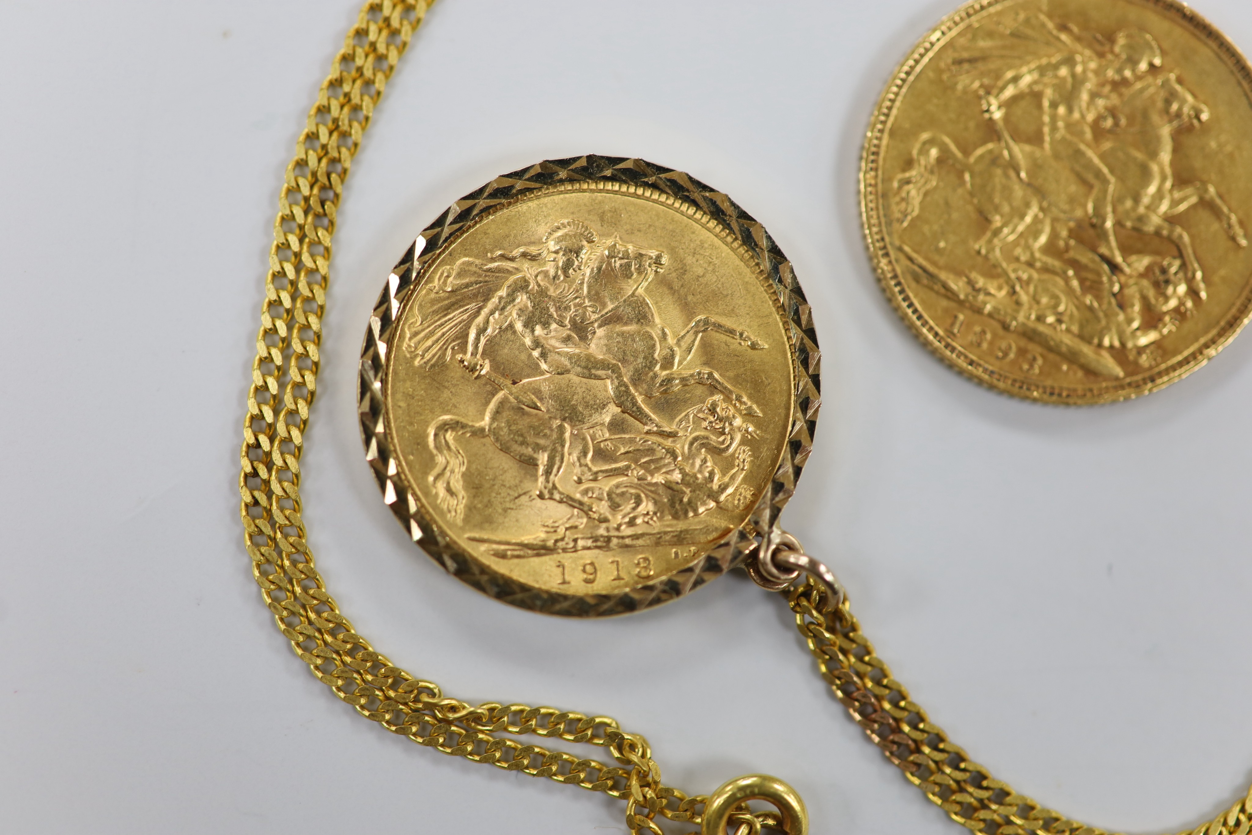 A Victorian 1893 gold sovereign and a 1913 god sovereign in a later 9ct gold pendant mount, on a 9ct chain, gross weight 11.3 grams.